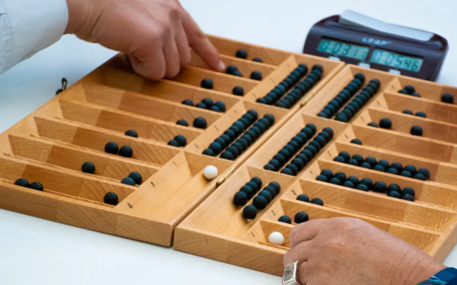 Togyzkumalak traditional board game